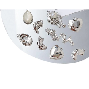 Silver alloy heart and moon charms collection for DIY jewelry making with mirror reflections