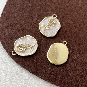 Detailed macro view of 14k gold plated rose pendants for DIY jewelry making