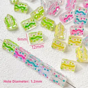 Macro shot of 12mm colorful dotted glass beads for DIY jewelry with 1.2mm hole