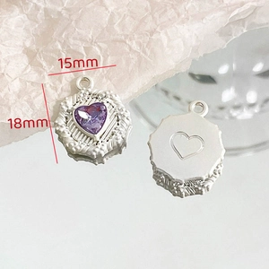 Macro view of 18mm heart-shaped purple gemstone pendant with silver octagonal frame