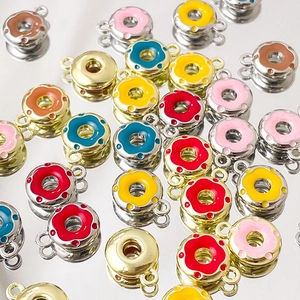 Colorful alloy donut charms for DIY jewelry making in various enamel colors and metallic finishes