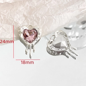 Macro shot of 24mm pink heart charm with silver melting design and dimensions