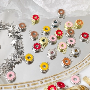 Colorful enamel donut pendants for DIY jewelry making on a star charm bracelet