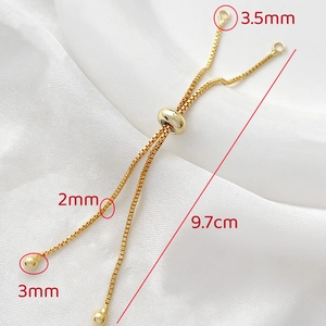 Detail of adjustable 14k gold-filled box chain with slider bead and size measurements