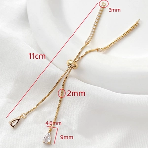 Detail of 14k gold-plated adjustable box chain with pear-cut zircon pendants and dimensions