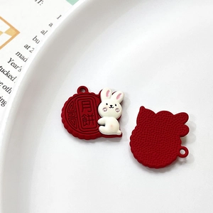Detail view showing front and back of rabbit mooncake charm for jewelry making