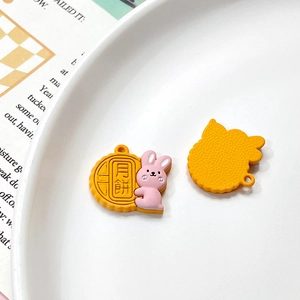 Close-up of DIY rabbit mooncake charm accessory for bracelets with handmade resin details