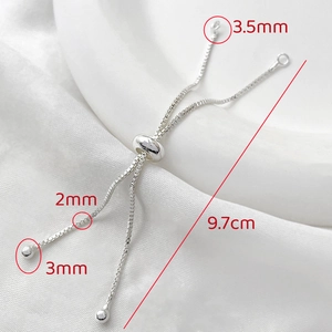 Macro detail of 2mm silver box chain with 3mm adjustable slider bead for DIY bracelets