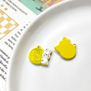 Close-up of rabbit mooncake alloy pendant on ceramic plate with trendy magazine background