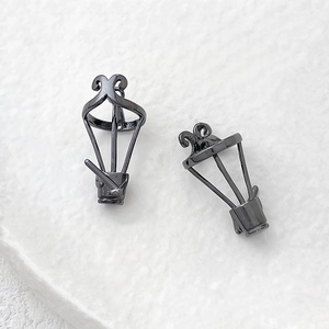 Macro view of two gunmetal balloon-shaped frames for DIY jewelry making and crafts