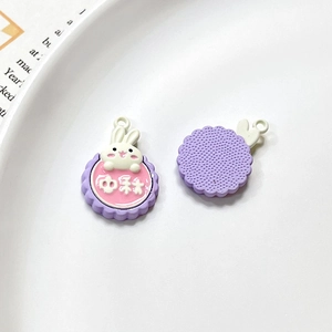 Detail showing front and back of rabbit mooncake alloy charms for DIY jewelry making