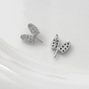 Detail of silver plated wing-shaped jewelry connectors with clear micro-pave zirconia