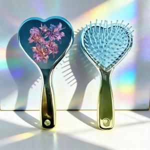 Floral heart-shaped hair brush set with blue orchid pattern and golden metallic handle