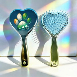 Detail of heart-shaped hairbrushes with cat claw clover patterns and metallic plating
