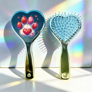 Detail showing the heart-shaped hair brush with cat paw print and blue cushion bristles