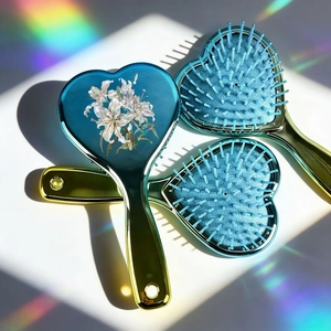 Gradient blue heart shaped paddle hair brushes with floral print and rainbow prism lighting