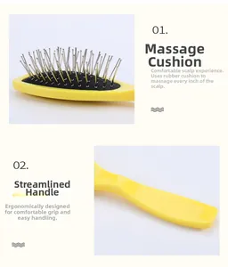 Detailed view of yellow massage hairbrush with ergonomic handle and cushioned steel pins