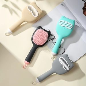Cute cat-ear shaped hair massage combs in four colors with ergonomic air cushion handles