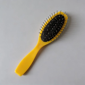 Brosse à cheveux jaune avec épingles en acier et coussin d'air pour massage du cuir chevelu