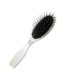 Brosse à cheveux pneumatique noir et blanc avec aiguilles métalliques pour massage