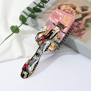 Cute air cushion massage hairbrush with God of Wealth print on a silk background