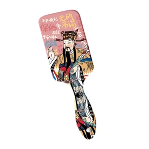 Pink air cushion hairbrush with God of Wealth print and traditional Chinese folk art
