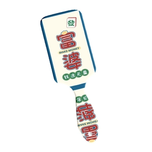 Cartoon massage hair brush with money theme print and white cushion on white background