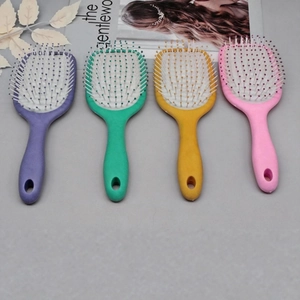 Ergonomic massage hair brush set with colorful handles in purple green yellow and pink