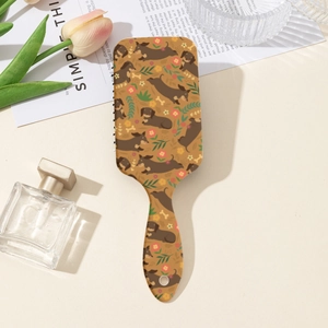 Détail de la brosse à cheveux rectangulaire avec motif de teckel et fleurs colorées