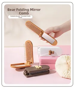 Detail of cute bear-shaped foldable pocket mirror and anti-static hair comb set