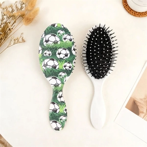 Detail of football pattern hairbrushes with ergonomic handles and massage air cushions