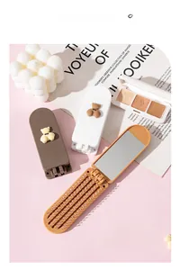 Foldable hair brush with mirror featuring a cute 3D bear design in multiple colors