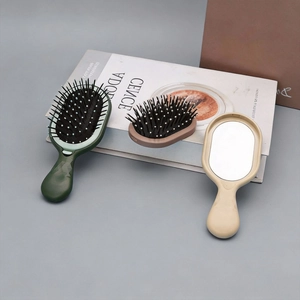 Portable air cushion hairbrush and mirror set with ergonomic handle in a minimalist style