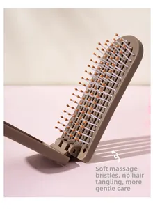 Close-up of flexible massage hairbrush bristles with soft ball tips on a foldable base