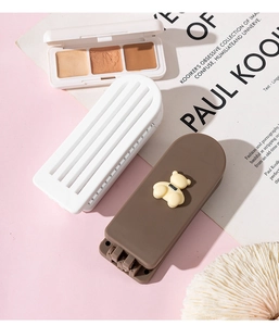 Detail of cute bear-shaped foldable makeup mirror with rectangular portable design