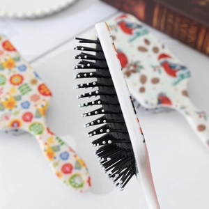 Cartoon printed air cushion hairbrush with ergonomic handle and soft round-tip bristles