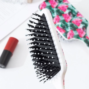 Brosse de massage à motif pastèque avec coussin d'air noir et cadre blanc robuste