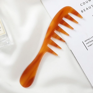 Portable acetate wide-tooth comb with elegant amber tortoise shell pattern design