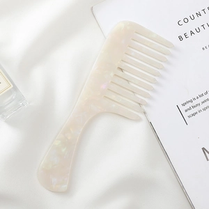Minimalist marble pattern wide-tooth hair comb in pearl white acetate on silk fabric