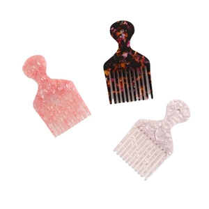 Three-piece acetate wide-tooth hair comb set with pink, tortoiseshell, and marble patterns