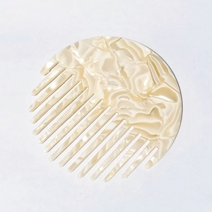 Round acetate hair comb with cream marble pattern, anti-static hair styling accessory