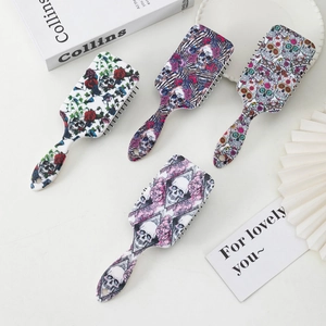 Sugar skull and rose pattern hair brush set with ergonomic handles and massage air cushion