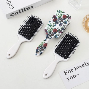 Three-piece hair brush set with sugar skull rose pattern and anti-static massage air cushions