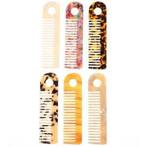 Detailed set of six acetate hair combs featuring colorful marble and tortoiseshell patterns