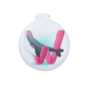 Foldable round hairbrush with vanity mirror featuring cartoon whale and W design