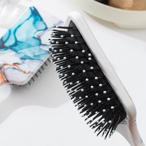 Square paddle brush with marble pattern back and nylon bristles with massage tips