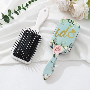 Mint green cushion hair brush featuring rose prints and gold I Do wedding lettering
