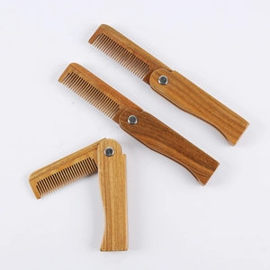 Set of three portable folding sandalwood combs with natural wood grain and metal hinge