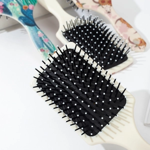 Brosse à cheveux style western avec imprimés floraux et coussin d'air massant doux