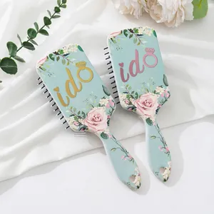Teal air cushion hairbrush set with floral rose pattern and 'I Do' ring graphic design